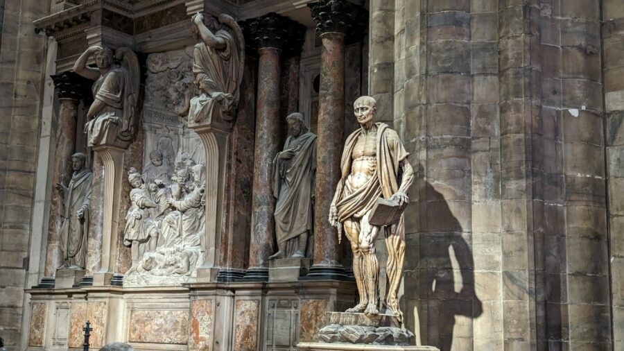 Milan Destination Guide: The Model of Fashion, Food, and Gothic Grandeur 5 Statues and reliefs in historical architecture.