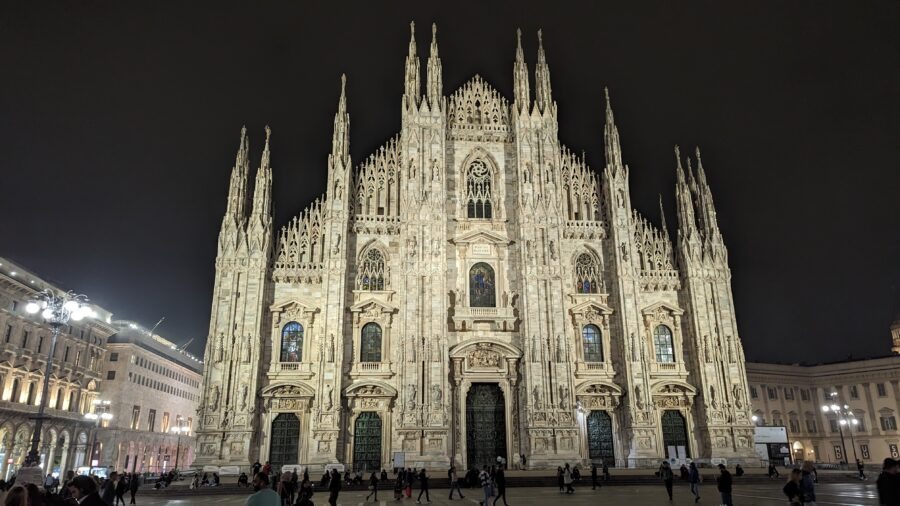 Milan Destination Guide: The Model of Fashion, Food, and Gothic Grandeur 3 Gothic cathedral illuminated at night.